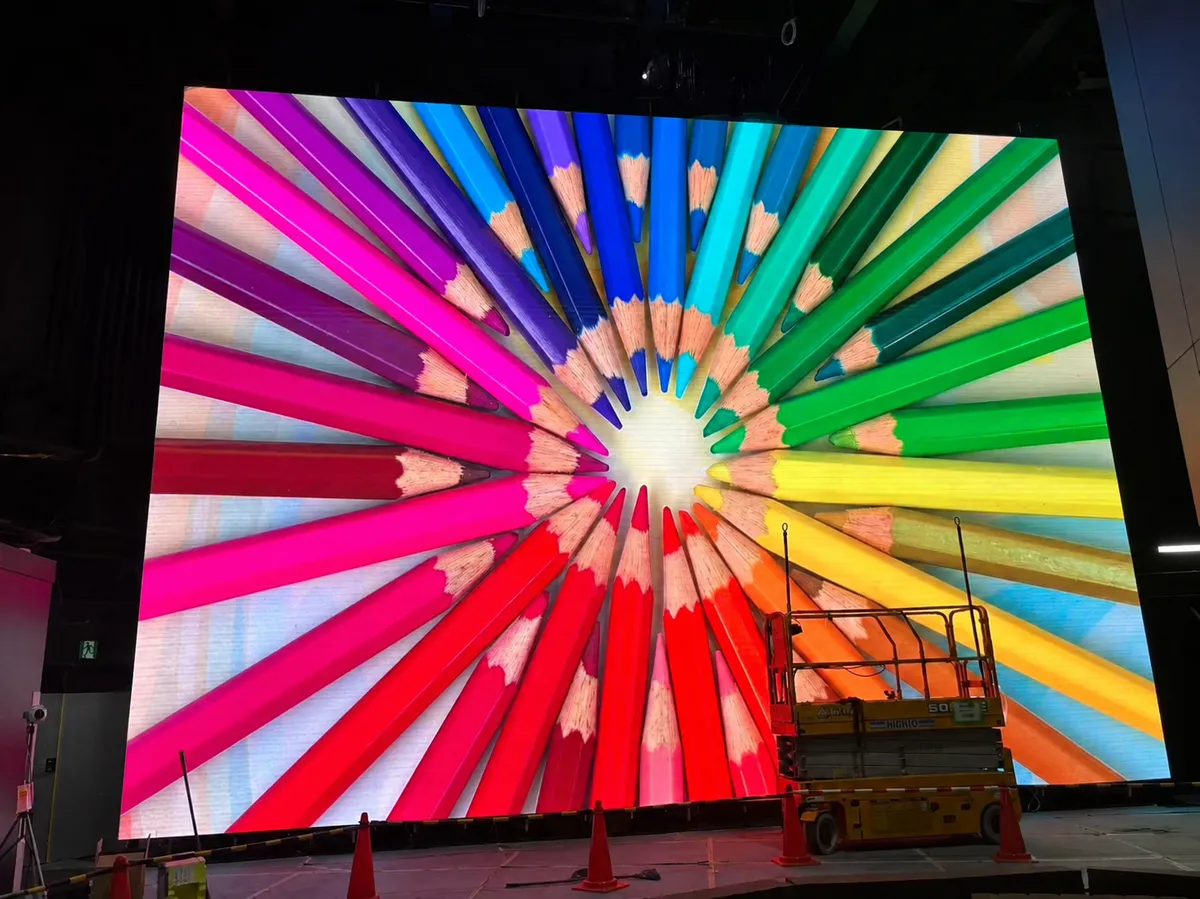 Giant LED screen showing colouring pencils, during installation